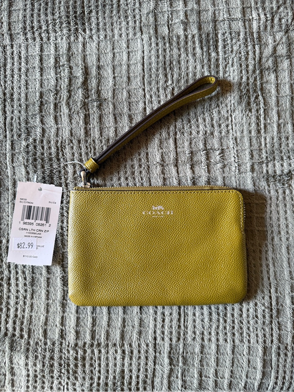 Coach Pebbled Leather Wristlet in Yellow